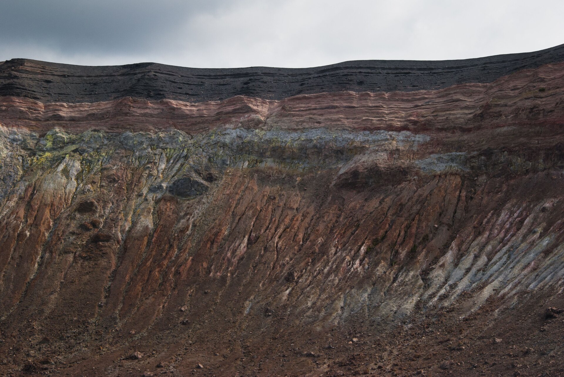 Natural geological strata cross-section displaying layered mineral horizons