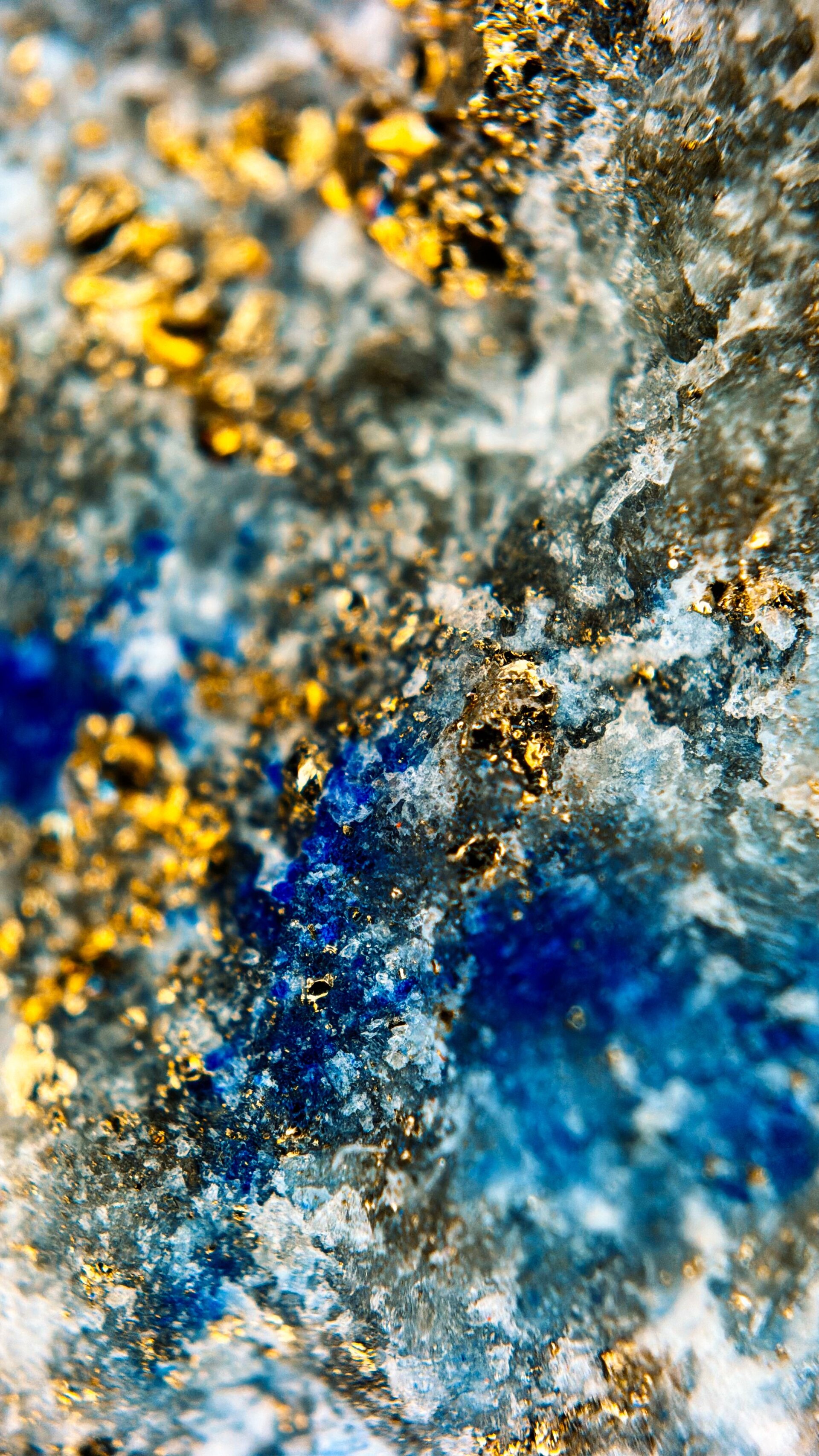 Natural mineral matrix with deep sapphire blue crystallization and sparkling gold flecks