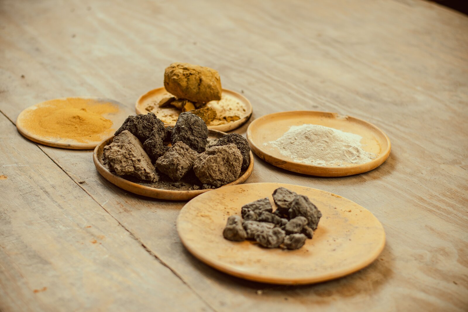Raw mineral earth clods separated into high-volume industrial commodities, critical minerals, and refined end products